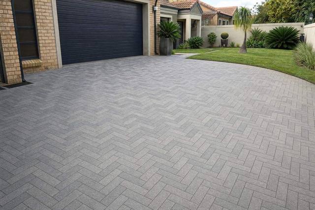 Herringbone: long pavers in long large-format pavers, Granite