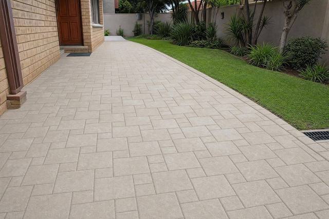 Stretcher bond: half & quarter in square cobbles, Cement