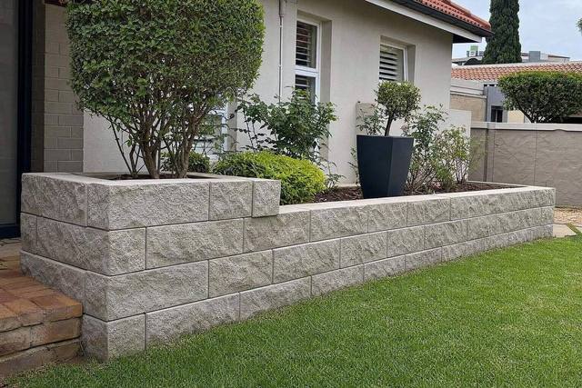 Rock-face walling blocks
