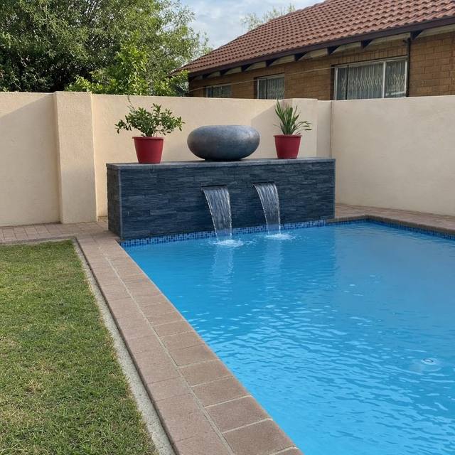 Slate feature wall at the pool